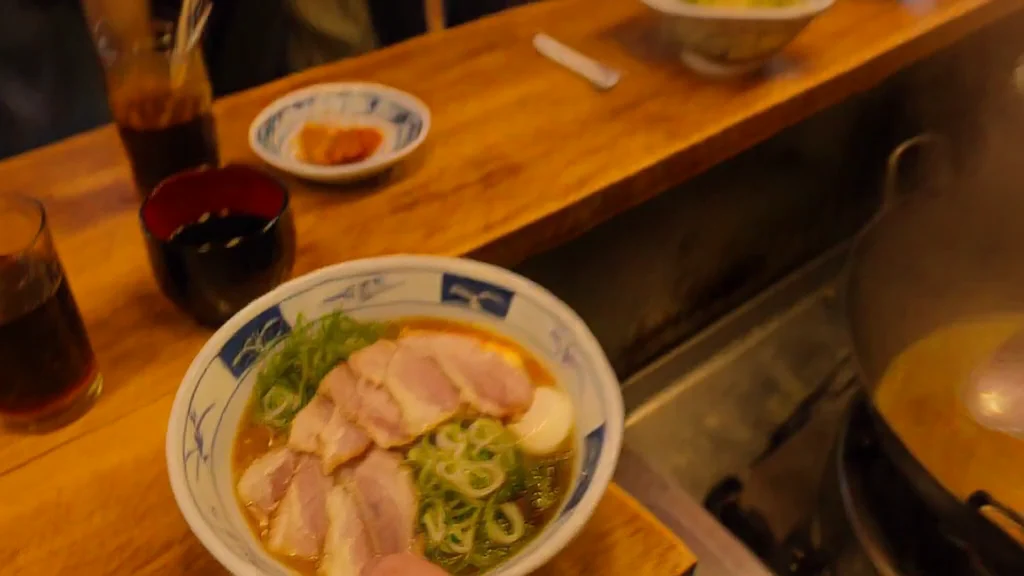 MiniMax H3 Osaka ramen chef cooking and serving at night